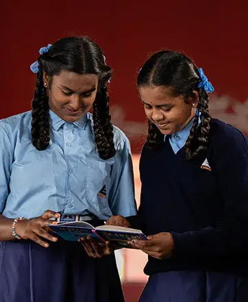 community outreach by embassy group - student reading 