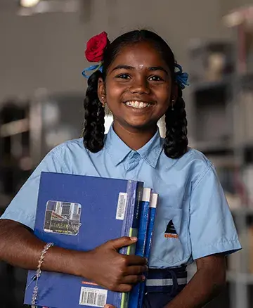 community outreach by embassy group - girl ready to go to school